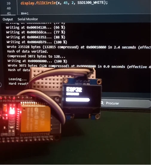ESP32 connected to an SSD1306 OLED display showing text using Arduino IDE